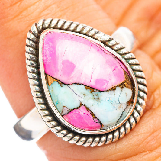 Sterling silver ring with oval pink gemstone and turquoise inlay, rope bezel details