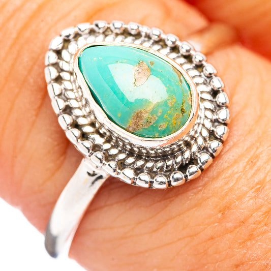 Turquoise teardrop cabochon sterling silver ring with beaded halo bezel