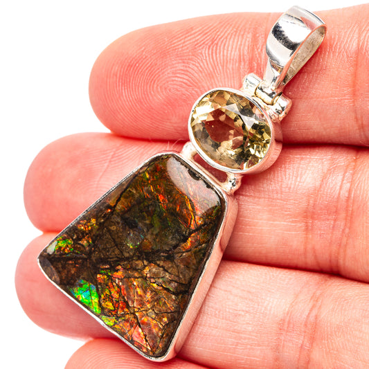 Sterling silver pendant close-up: oval yellow quartz and rectangular ammolite in prongs
