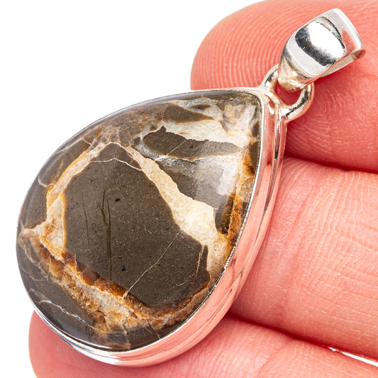 Septarian geode pendant in teardrop shape with brown and black stone, sterling silver bezel