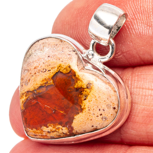 Heart-shaped fire opal pendant in .925 sterling silver with metal bail.