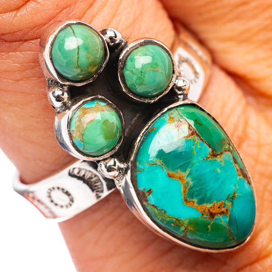 Turquoise cabochon sterling silver ring with oval and round stones in clustered setting