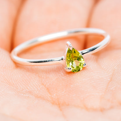 Sterling silver stacking ring with green oval peridot center stone