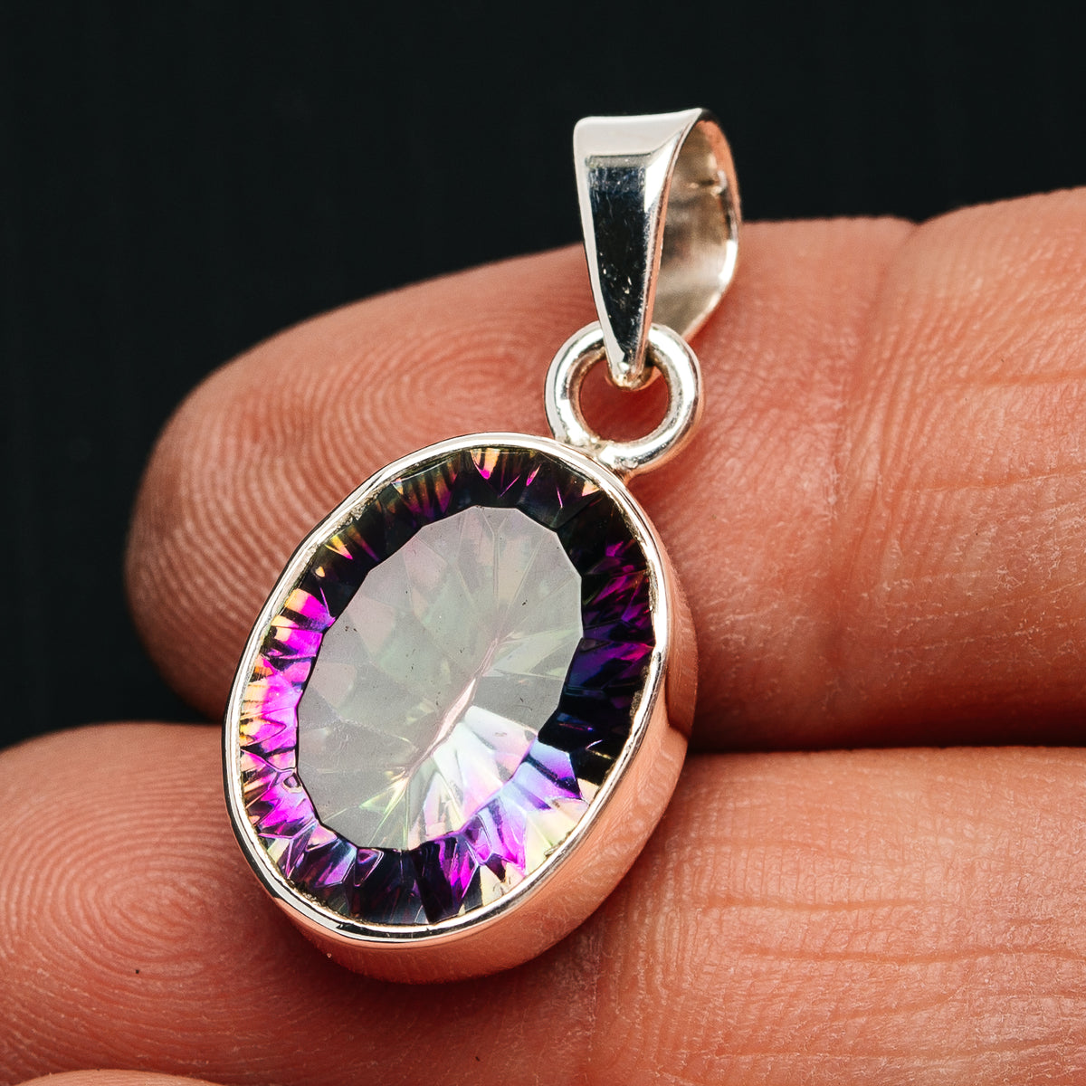 Oval rainbow mystic topaz pendant with .925 sterling silver bezel and bail