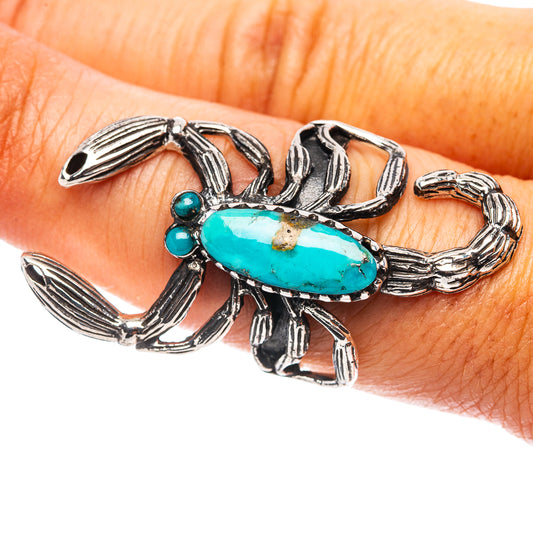 Sterling silver turquoise scorpion ring, oval stone with claws across finger