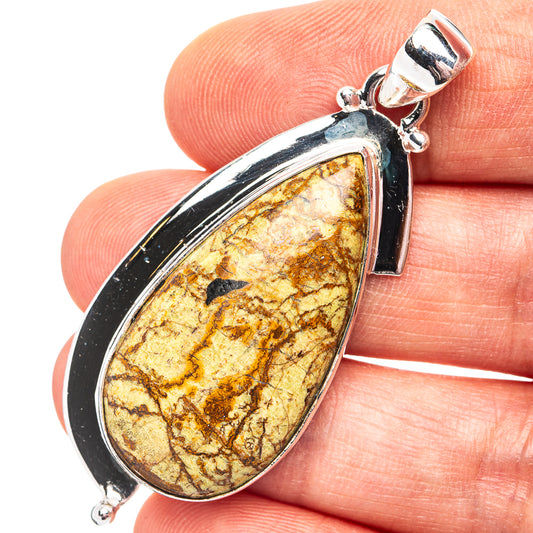 Teardrop gaspeite pendant in .925 sterling silver with mottled gold-green center