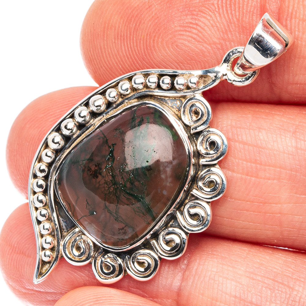 Oval green moss agate pendant with ornate 925 sterling silver bezel and loop bail.