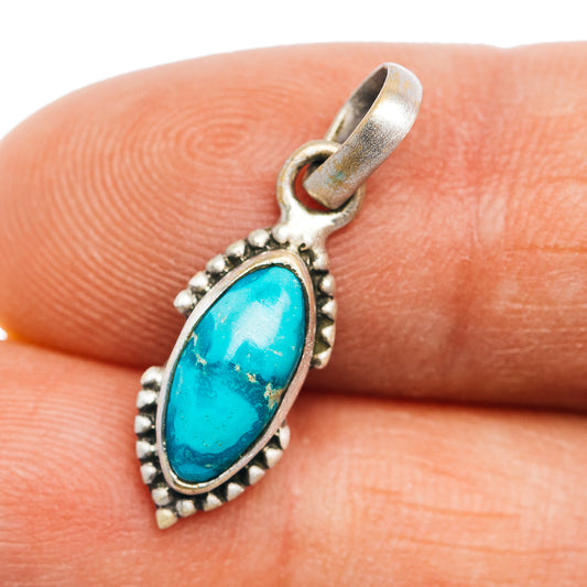 Turquoise oval pendant in .925 silver with beaded border and loop bail