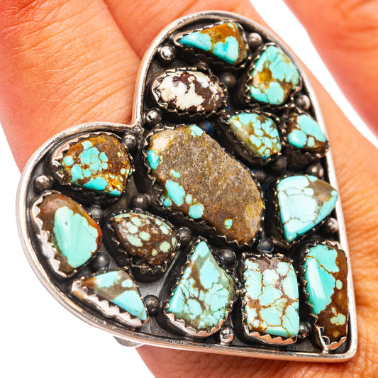 Heart-shaped ring with multiple turquoise cabochon stones in an ornate sterling bezel