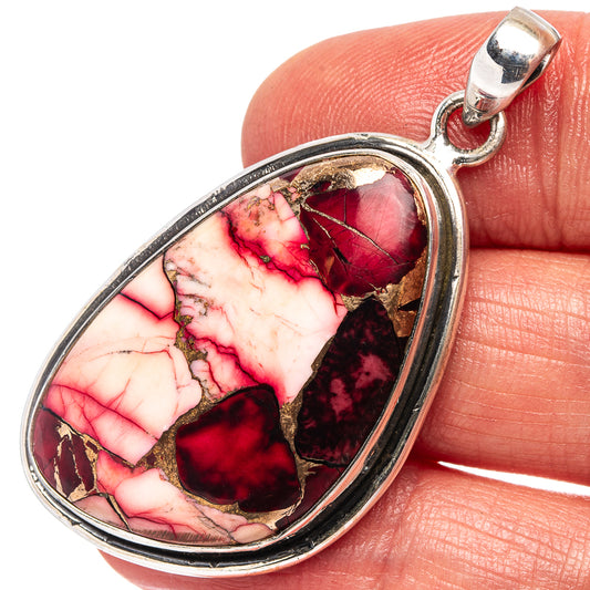 Sterling silver teardrop pendant with red-pink stone inlay and hanging bale