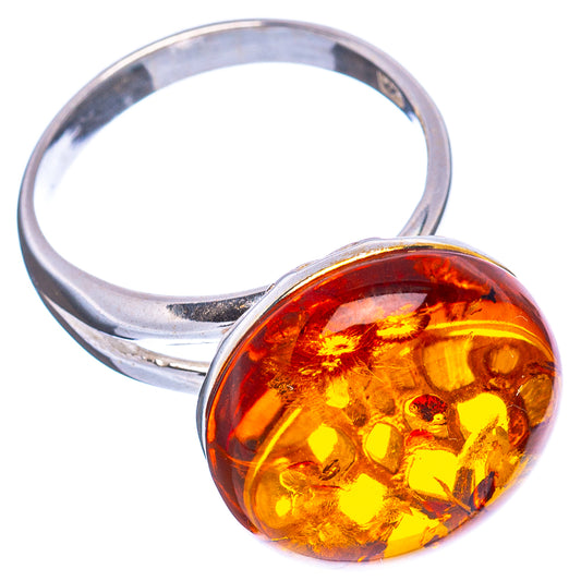 Sterling silver open band with oversized round amber cabochon in honey and orange tones