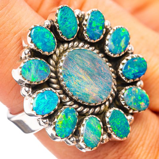 Opal doublet sterling silver ring with oval blue-green stones and round center
