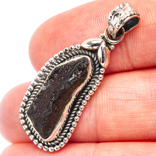 Sterling silver moldavite pendant with dark stone and beaded halo on bail