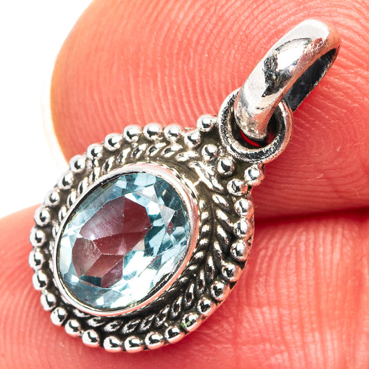 Sterling silver blue topaz pendant with ornate beadwork and open bail