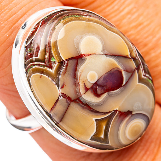 Sterling silver ring with crazy lace agate oval cabochon, banded cream and burgundy.