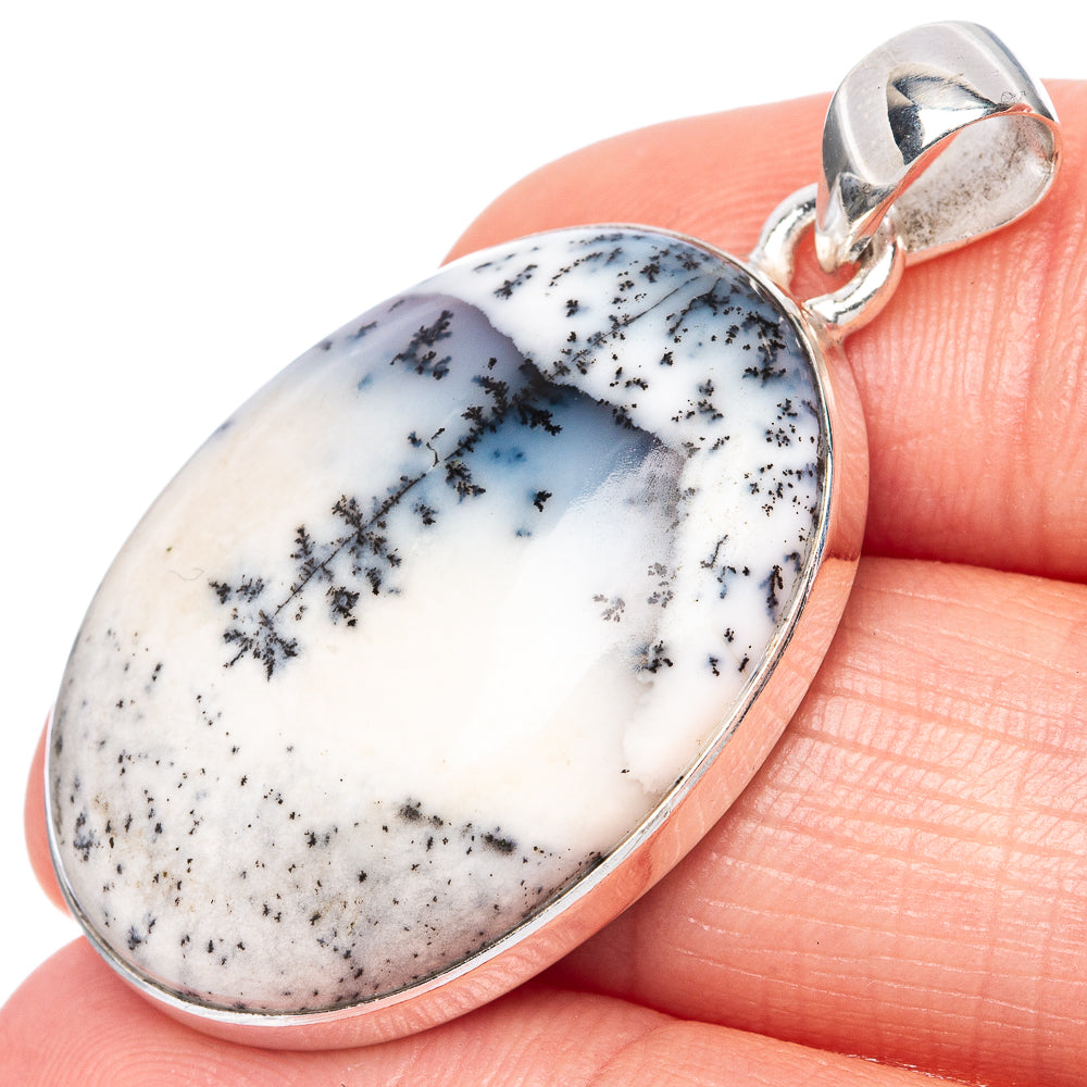 Oval dendritic opal pendant in sterling silver with loop bail, close-up view