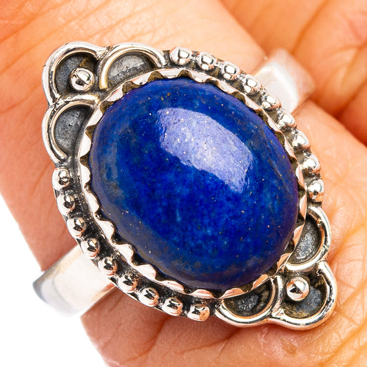 Sterling silver oval lapis lazuli ring with ornate bead and scroll setting