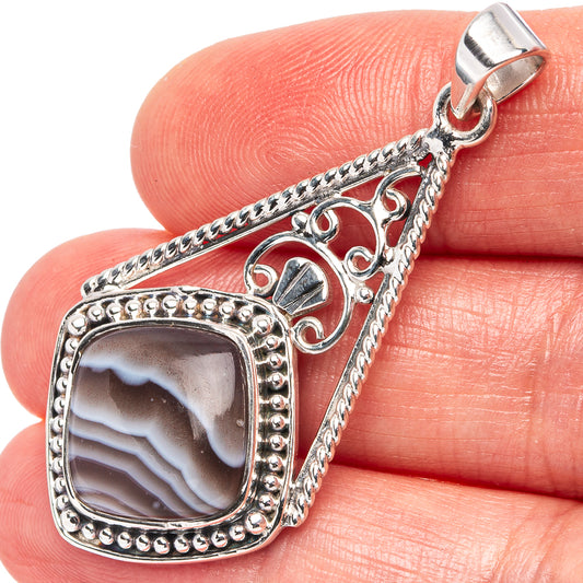 .925 sterling silver pendant with square bezel and banded Botswana agate stone