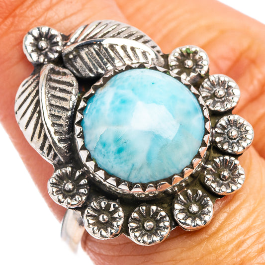Sterling silver larimar ring with oval blue gemstone and ornate leaf-and-flower setting