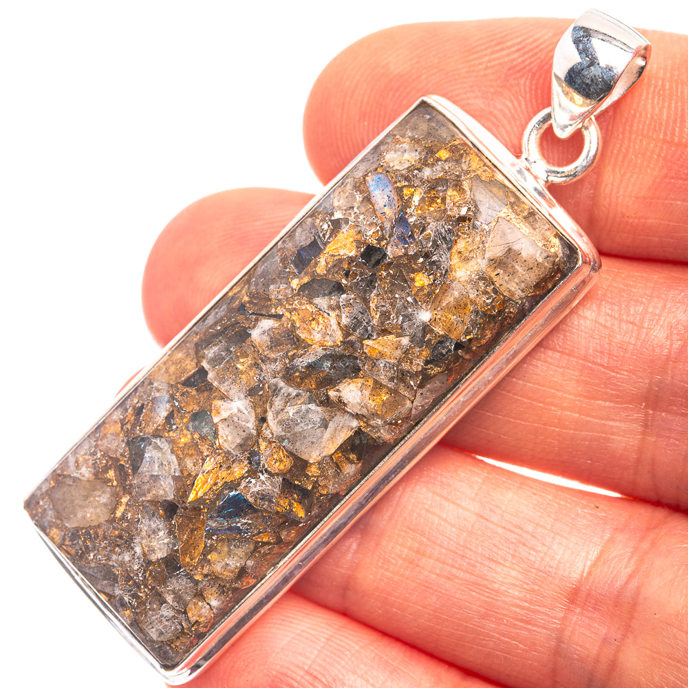 Rectangular labradorite pendant with copper-gold flecks in 925 silver frame, bail loop.