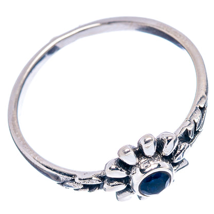 Sterling silver dainty ring with blue quartz flower head and detailed band, side view