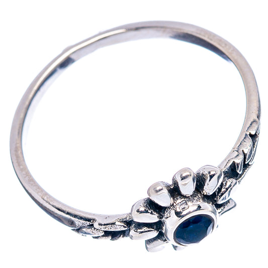 Sterling silver dainty ring with blue quartz flower head and detailed band, side view