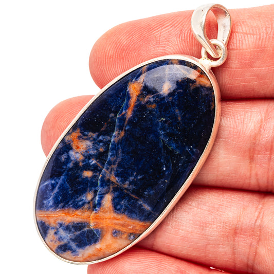 Sodalite oval pendant with blue and orange veining, set in .925 sterling silver