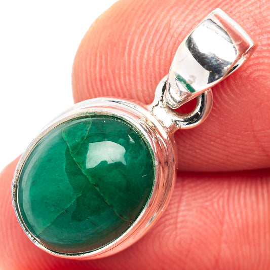 Oval green emerald cabochon pendant in .925 sterling silver bezel, close-up detail