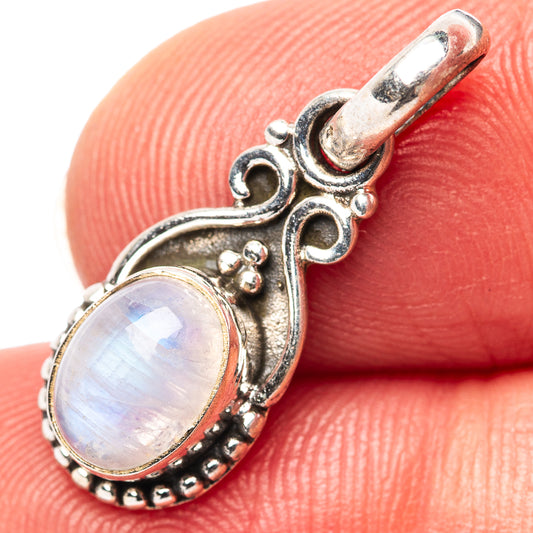 Oval moonstone pendant in .925 sterling silver with ornate filigree and setting