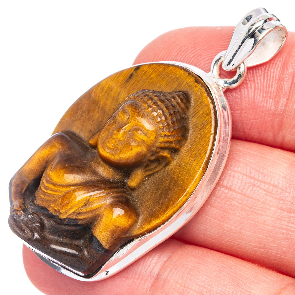 Tiger eye Buddha pendant in 925 sterling silver frame with carved face, bail at top
