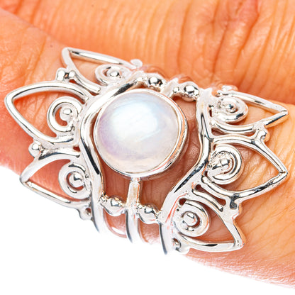 Sterling silver moonstone ring with oval iridescent center and ornate scrolling setting