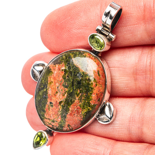 Unakite stone pendant with small green peridot round stones, sterling silver bail