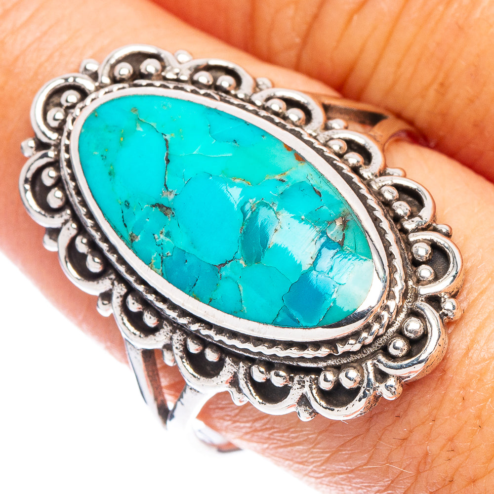 Oval turquoise cabochon sterling silver ring with ornate scalloped bezel