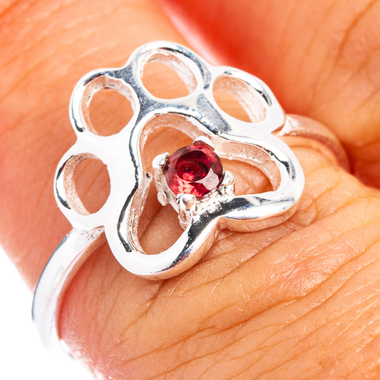 Sterling silver paw print ring with red garnet gemstone accents