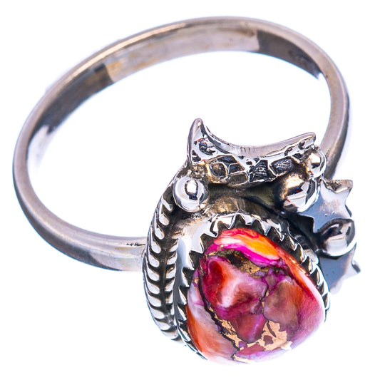 Sterling silver ring with pink teardrop inlay, side scrollwork and open band