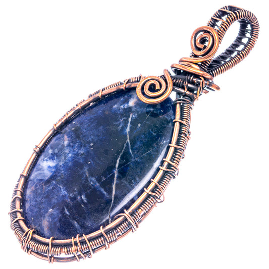 Wire-wrapped blue sodalite teardrop pendant with oxidized copper spiral frame