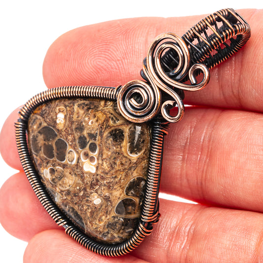 Oxidized copper wire-wrap pendant with turritella agate teardrop stone and spiral rings