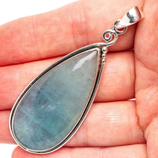 Aquamarine teardrop pendant in .925 sterling silver with ornate bail