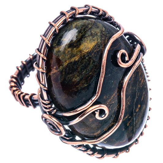 Oxidized copper wire-wrapped ring with dark oval pietersite stone and spiral accents