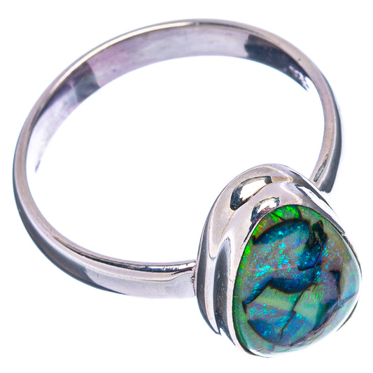 Sterling silver opal ring with green-blue teardrop cabochon, side angle on band