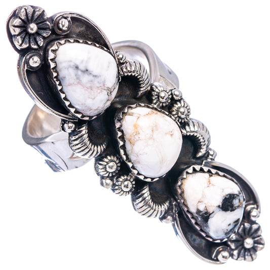 Silver adjustable ring showing three oval white buffalo stones on a carved setting