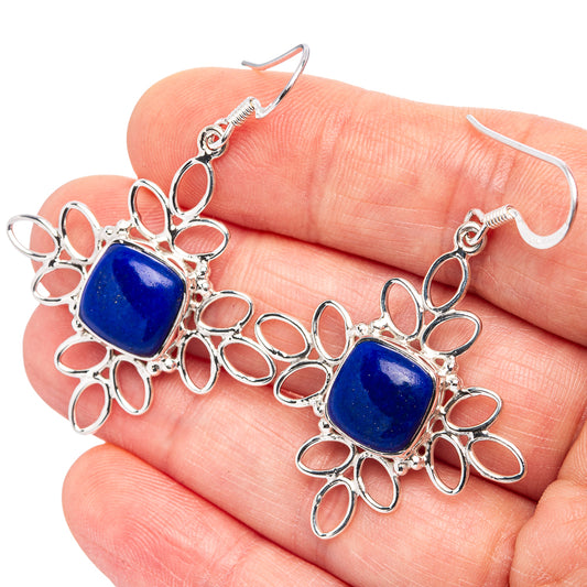 Close-up lapis lazuli square earrings with .925 sterling silver floral frames and blue stones