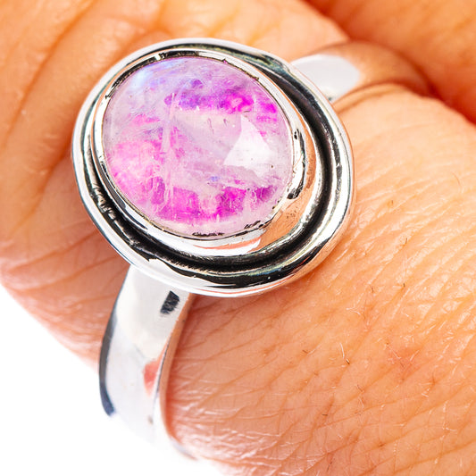 Pink moonstone bezel ring with sterling silver band, round stone setting detail