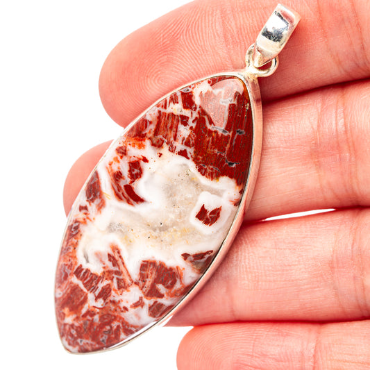Sterling silver teardrop pendant with red-and-white rainbow jasper stone