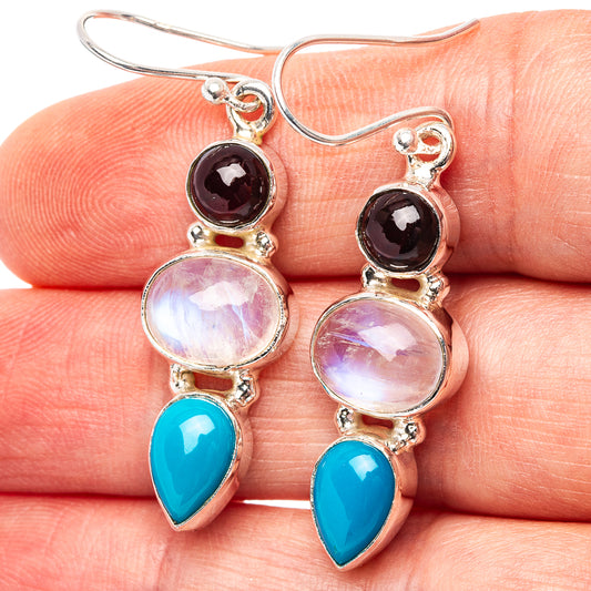 Sterling silver drop earrings with purple round, pink moonstone, and blue teardrop stones