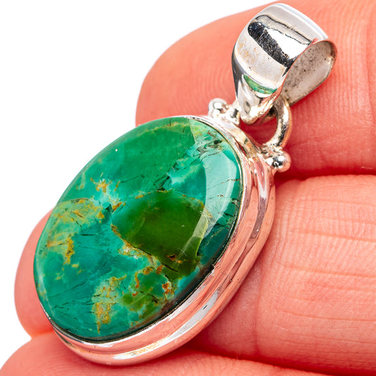 Turquoise oval cabochon pendant with .925 sterling silver bezel and bail, close-up