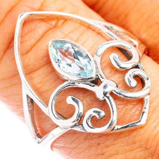 925 sterling silver ring with oval blue topaz and ornate swirl filigree
