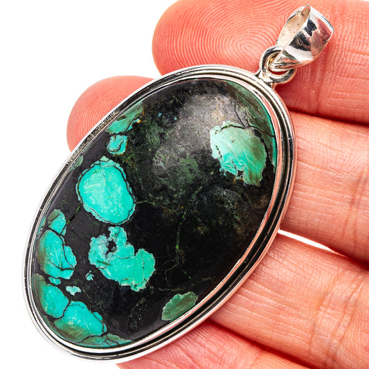 Oval turquoise cabochon pendant in .925 sterling silver with stone marbling