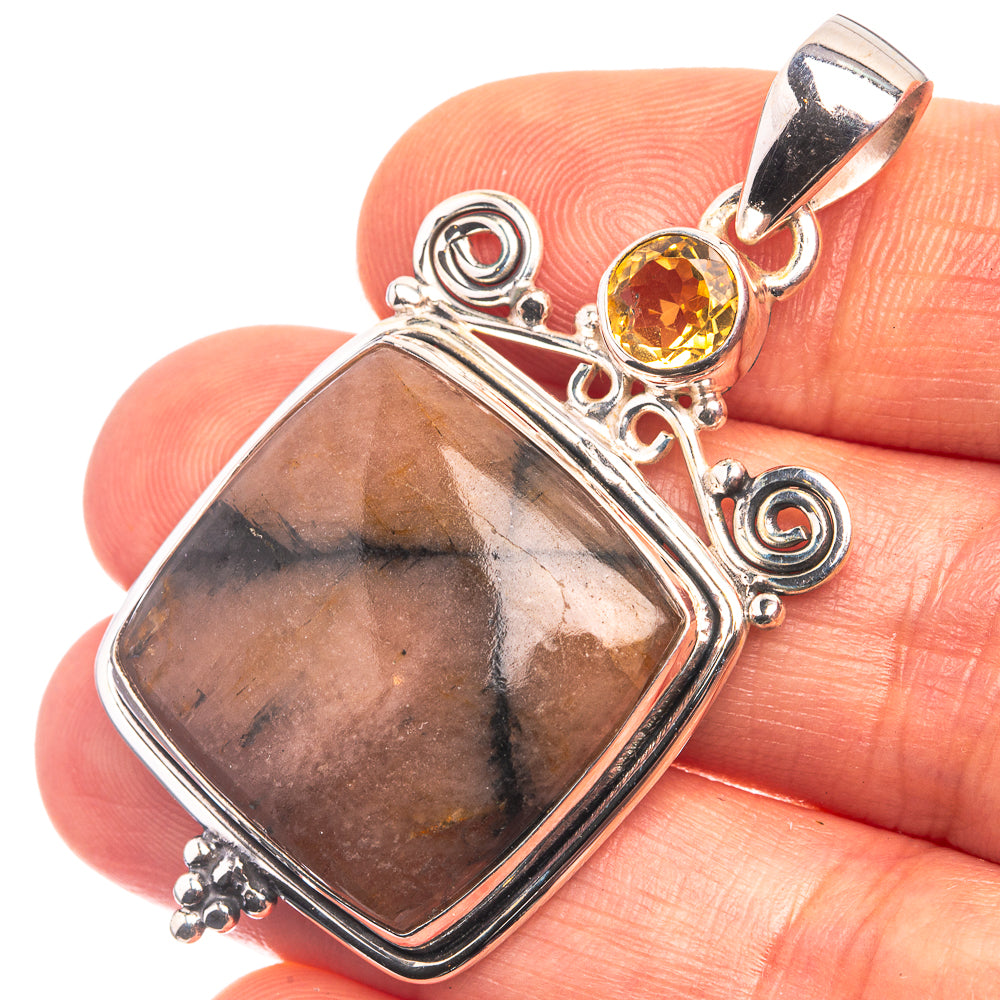 Sterling silver pendant with rectangular chiastolite stone and round citrine accent