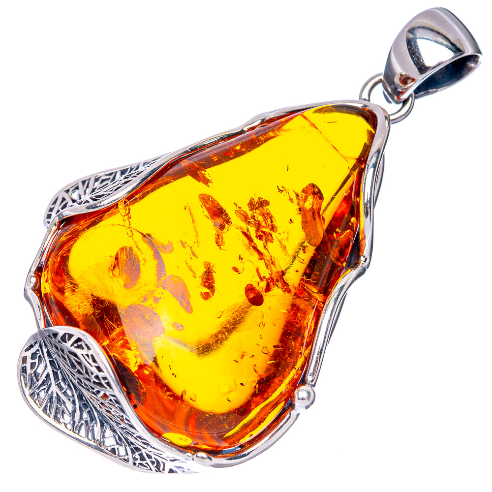 Sterling silver pendant with teardrop Baltic amber, ornate openwork edges and bail